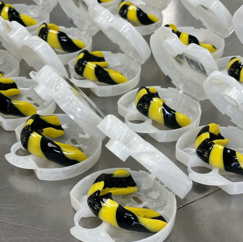 A batch of custom gumshields in cases, fresh from the lab
